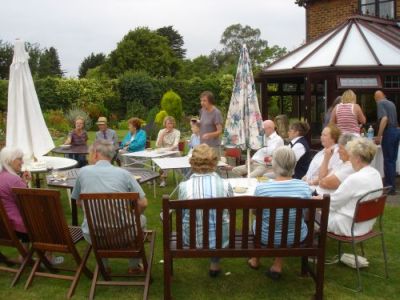 Members of the Help Holme Church Group relaxing after Open Gardens day and enjoying a chat over refreshments. - Photo Tony Foster