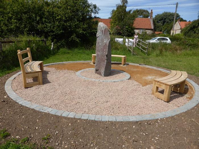 Filling in with the new granite chippings