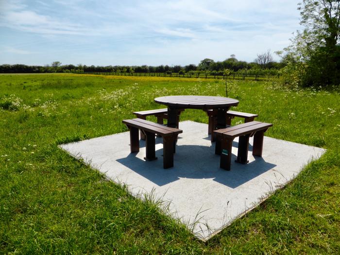 One of two sets of a picnic table and seats